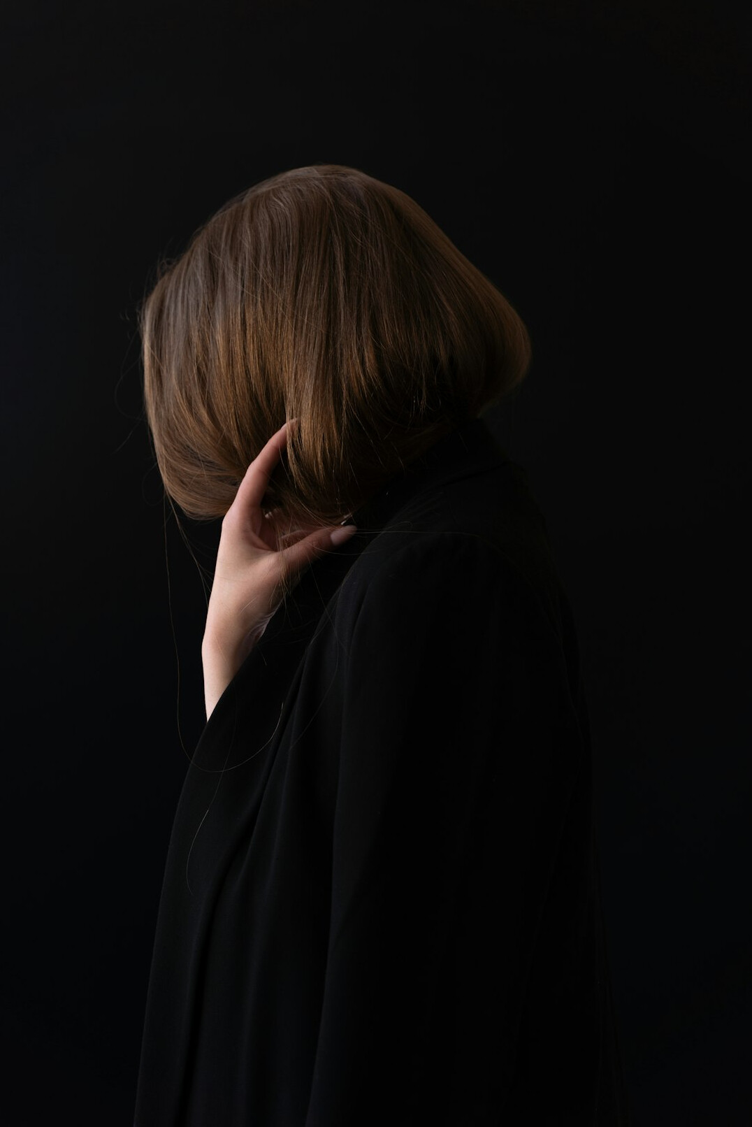 Studio portrait of a woman with short brown hair