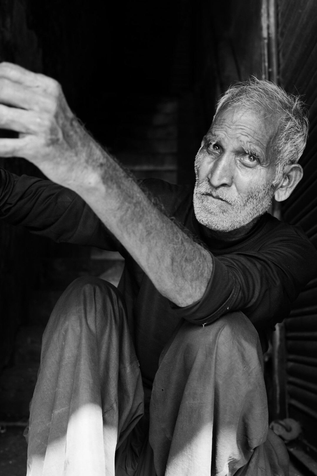 Studio portrait of an older man with grey hair