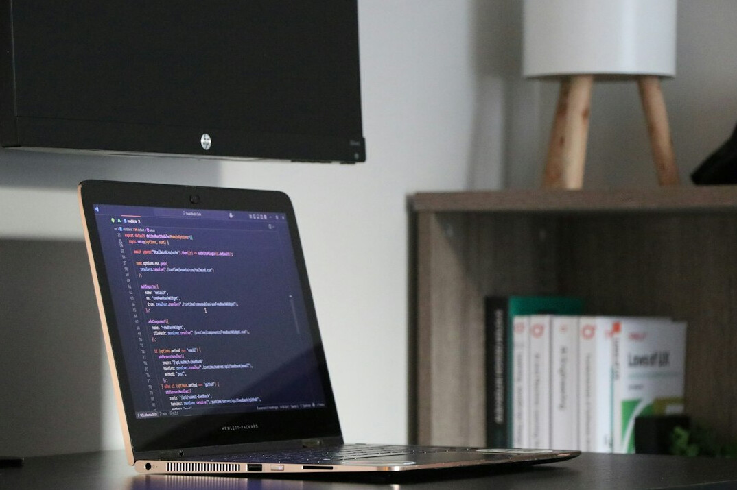Programmer working on insurance software at a desk